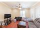Cozy living room with ceiling fan, hardwood floors and comfortable seating at 111 S Delaware Ave # 1, Tampa, FL 33606
