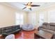 Bright living room with hardwood floors, fan, natural light and comfortable seating at 111 S Delaware Ave # 1, Tampa, FL 33606