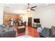 Open-concept living area with hardwood floors and seamless access to the kitchen and dining at 111 S Delaware Ave # 1, Tampa, FL 33606
