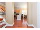 View of the open kitchen and dining area featuring hardwood floors and tan walls at 111 S Delaware Ave # 1, Tampa, FL 33606
