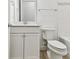 Well-lit bathroom with a neutral vanity, and a toilet next to the bathtub at 11432 Shoreline Trl, Parrish, FL 34219