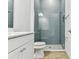Bathroom showcasing a tiled shower with glass door and modern fixtures at 11432 Shoreline Trl, Parrish, FL 34219