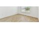 Bedroom featuring tile floors and a bright window at 11432 Shoreline Trl, Parrish, FL 34219