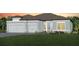 Charming single-story home with a three-car garage, manicured lawn, and tasteful landscaping at 11432 Shoreline Trl, Parrish, FL 34219