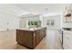 Open concept kitchen with a large island and stainless steel appliances at 11432 Shoreline Trl, Parrish, FL 34219