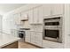 Gourmet kitchen showcasing stainless steel appliances and beautiful backsplash at 11432 Shoreline Trl, Parrish, FL 34219