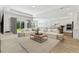 Bright and airy living room featuring neutral tones, plush seating, and an open floor plan with sliding door access at 11432 Shoreline Trl, Parrish, FL 34219