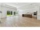 Open concept living space showcasing the kitchen and access to the backyard at 11432 Shoreline Trl, Parrish, FL 34219