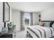 Inviting bedroom with striped bedding, dark dresser, and modern decor at 11715 Blackbrook Ct, Seffner, FL 33584
