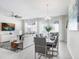 Dining area with contemporary furnishings and seamless flow into living room at 11715 Blackbrook Ct, Seffner, FL 33584