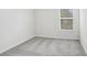 Cozy bedroom featuring neutral carpeting and a window that brightens the space at 11723 Blackbrook Ct, Seffner, FL 33584
