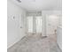 Neutral upstairs landing with plush carpeting, and multiple doorways leading to other rooms at 11723 Blackbrook Ct, Seffner, FL 33584