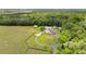 The property features a charming red barn and well-maintained landscaping at 12345 Citrus Way, Brooksville, FL 34601