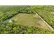 Expansive acreage features a fenced perimeter and wooded surroundings, providing ample privacy at 12345 Citrus Way, Brooksville, FL 34601