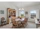 Bright dining room with a chandelier, wooden table, and charming hutch, perfect for Gathering gatherings at 12345 Citrus Way, Brooksville, FL 34601