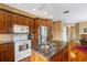 Well-equipped kitchen with stainless steel appliances and ample counter space at 12345 Citrus Way, Brooksville, FL 34601