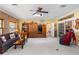 Relaxing living room with brick wall, built in, and natural light at 12345 Citrus Way, Brooksville, FL 34601