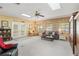 Expansive living room with ample seating and natural light at 12345 Citrus Way, Brooksville, FL 34601