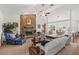 Open-concept living room boasts a vaulted ceiling, stone fireplace, and seamless flow to the dining area at 12345 Citrus Way, Brooksville, FL 34601