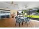 Enclosed patio offers outdoor dining space and pool views at 12345 Citrus Way, Brooksville, FL 34601
