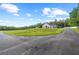 A large circular drive leads to a home with a big grassy yard at 12345 Citrus Way, Brooksville, FL 34601
