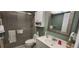 Well-maintained bathroom with a shower, vanity, and ample lighting at 1235 S Highland Ave # 5-402, Clearwater, FL 33756