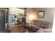 Living room view showcasing sofa, table, and connecting kitchen area at 1235 S Highland Ave # 5-402, Clearwater, FL 33756