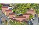 Aerial view of multi-Gathering roofs surrounded by mature trees and parking areas at 12425 Touchton Dr # 77, Tampa, FL 33617