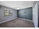 Comfortable bedroom features carpeted floors, fresh paint, and a bright window at 12425 Touchton Dr # 77, Tampa, FL 33617