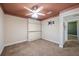 Cozy bedroom with a murphy bed, modern ceiling fan and neutral colored walls at 12425 Touchton Dr # 77, Tampa, FL 33617