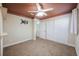 Cozy bedroom features a murphy bed, closet space, and neutral colored walls at 12425 Touchton Dr # 77, Tampa, FL 33617