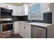 Updated kitchen featuring stainless steel appliances, sleek countertops, and modern fixtures at 12425 Touchton Dr # 77, Tampa, FL 33617