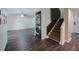 View of the living room featuring a stacked washer/dryer and a staircase at 12425 Touchton Dr # 77, Tampa, FL 33617