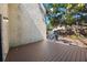 Back patio features a composite deck, stucco walls and covered barbeque at 12425 Touchton Dr # 77, Tampa, FL 33617