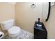 This half bath features a modern sink and hexagon tile floors at 12425 Touchton Dr # 77, Tampa, FL 33617