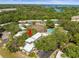 Aerial view of townhome community with pool, tennis courts, and lush landscaping at 1303 N Mcmullen Booth Rd # 1303, Clearwater, FL 33759