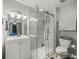 Bathroom with a tiled shower, a white vanity and a toilet, creating a clean aesthetic at 1303 N Mcmullen Booth Rd # 1303, Clearwater, FL 33759