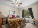 Bedroom with neutral walls and carpet, a queen-sized bed and a window at 1303 N Mcmullen Booth Rd # 1303, Clearwater, FL 33759
