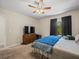 Bedroom with a view of a window with black curtains and a light-colored fan at 1303 N Mcmullen Booth Rd # 1303, Clearwater, FL 33759