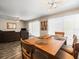Open-concept area with dining table and view into the adjacent living room at 1303 N Mcmullen Booth Rd # 1303, Clearwater, FL 33759