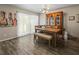 Well-lit dining space with a wooden table, ample seating, and stylish decor at 1303 N Mcmullen Booth Rd # 1303, Clearwater, FL 33759