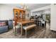 Inviting dining area with a wooden table, bench seating, and modern light fixture at 1303 N Mcmullen Booth Rd # 1303, Clearwater, FL 33759