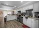 Modern kitchen with stainless steel appliances, granite countertops, and ample storage at 1303 N Mcmullen Booth Rd # 1303, Clearwater, FL 33759
