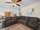 Spacious living room featuring a comfortable sectional sofa and ceiling fan at 1303 N Mcmullen Booth Rd # 1303, Clearwater, FL 33759