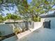 Enclosed outdoor patio with concrete and landscaped planter area at 1303 N Mcmullen Booth Rd # 1303, Clearwater, FL 33759