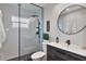 Modern bathroom with a walk-in shower featuring sleek fixtures and stylish design at 1310 Country Trails Dr, Safety Harbor, FL 34695
