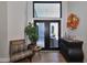 Welcoming foyer featuring double doors to the patio and designer decor at 1310 Country Trails Dr, Safety Harbor, FL 34695