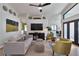 Inviting living room with comfortable seating, modern decor, and a seamless flow to other living spaces at 1310 Country Trails Dr, Safety Harbor, FL 34695
