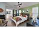 Inviting main bedroom with en-suite bathroom access, a ceiling fan, and neutral décor at 1310 Country Trails Dr, Safety Harbor, FL 34695