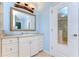 Bathroom with a white vanity and a decorative mirror adding an elegant touch at 1324 Eckles Dr, Tampa, FL 33612
